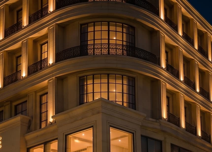 Detail of the curved corner façade, lit at night