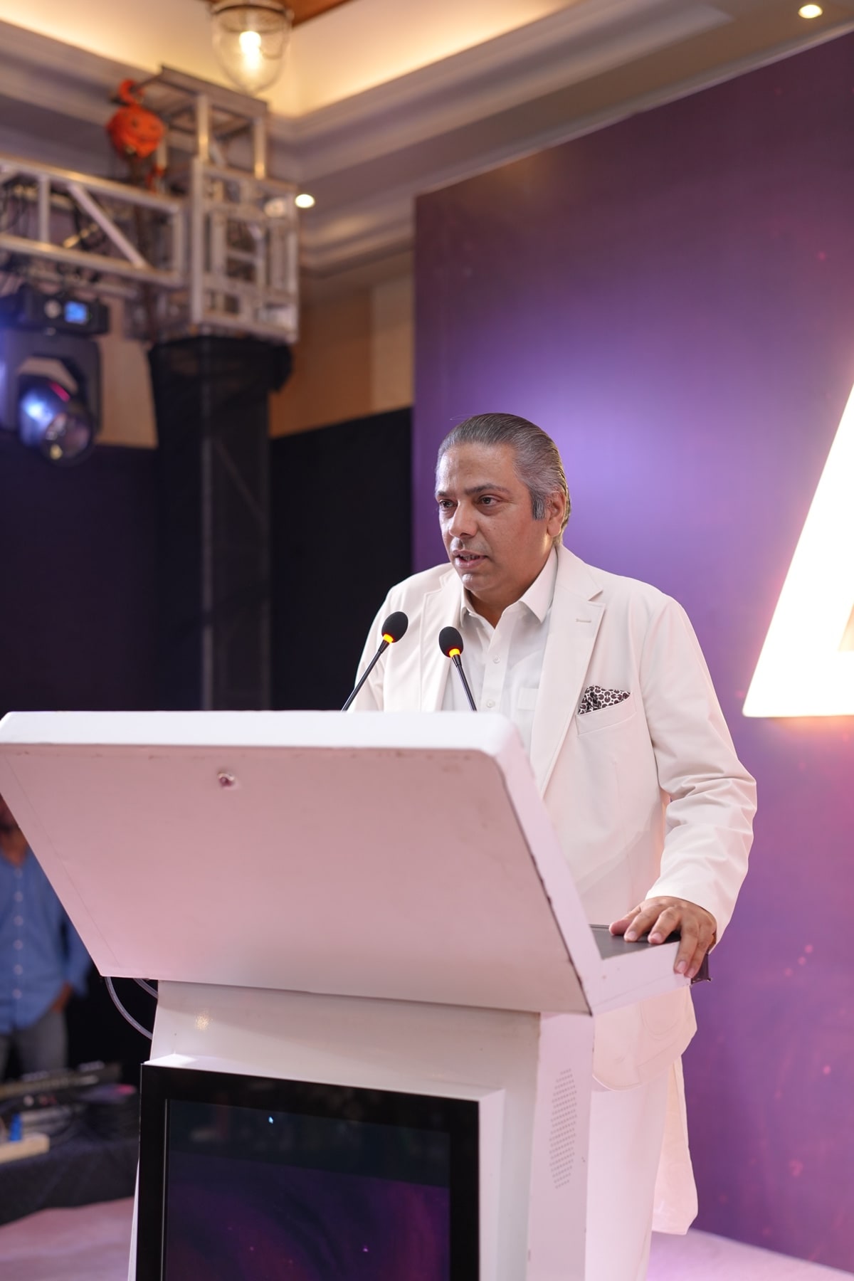 A guest speaking from the podium during the formal proceedings