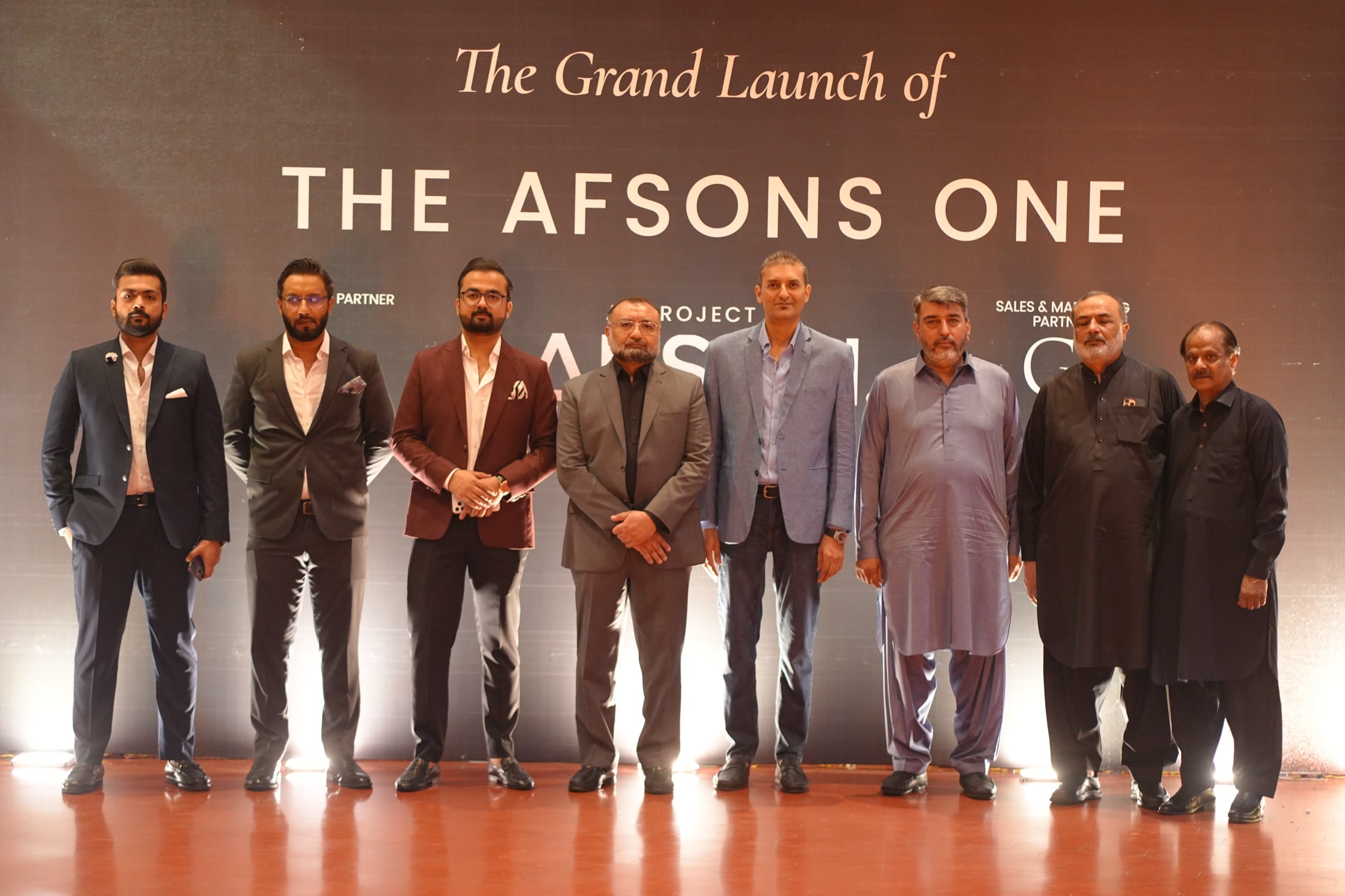 The launch backdrop reading The Grand Launch of THE AFSONS ONE, a project of Afson Developers