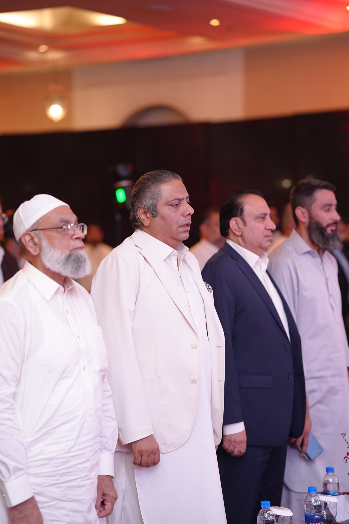 Guests standing for the national anthem at the opening of the evening